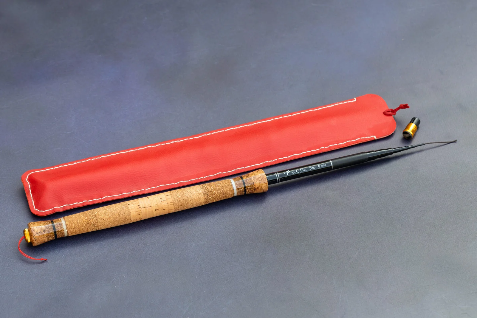 Fly Fishing Artisan Tenkara Graphite 340 hand-built fly fishing rod with 9 sections and red leather sock.