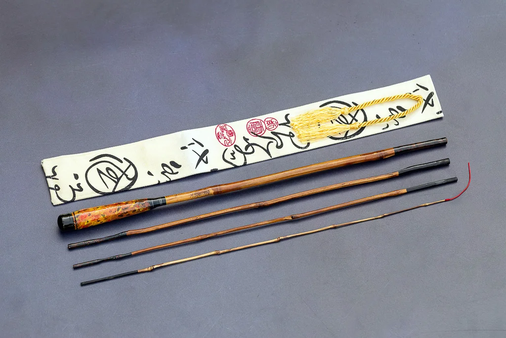 Handmade Tanago bamboo fishing rod with custom ergonomic handle and traditional cloth sock 1.94 meters